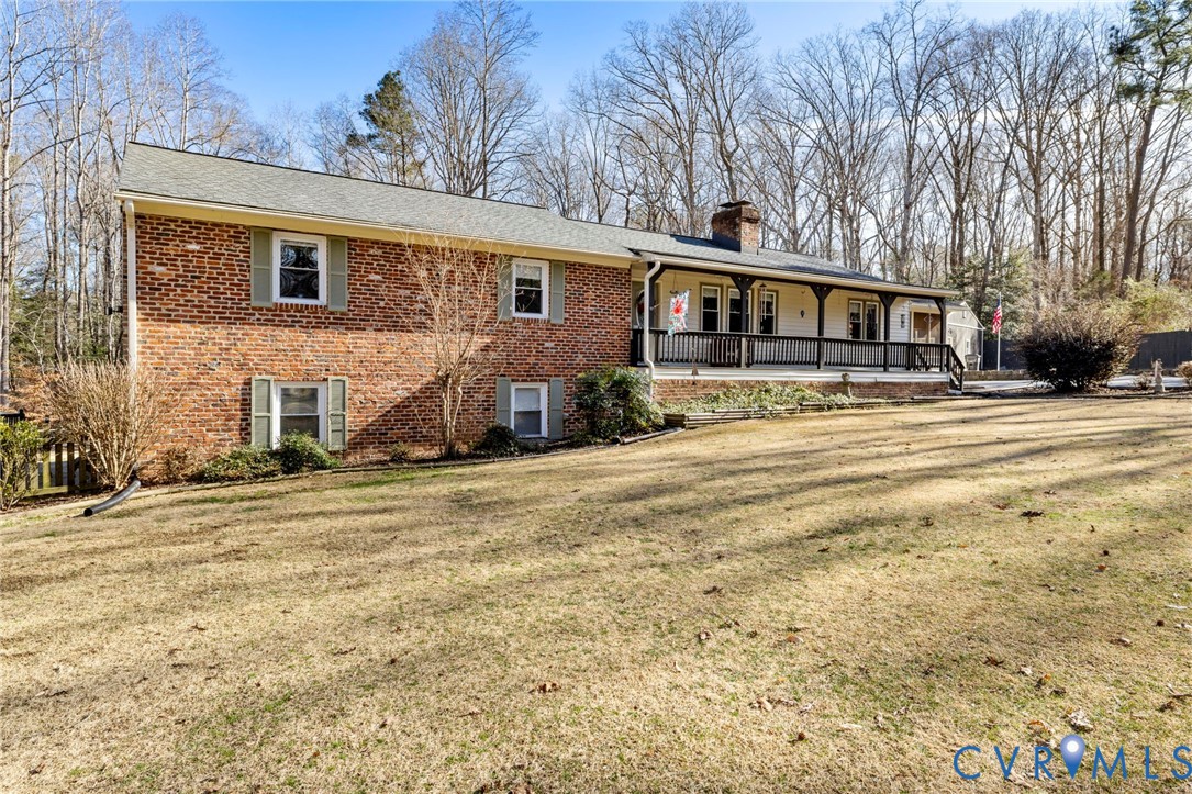 9411 Poly Place Midlothian, VA 23112 - Photo 1 of 39 a front view of a house with a yard
