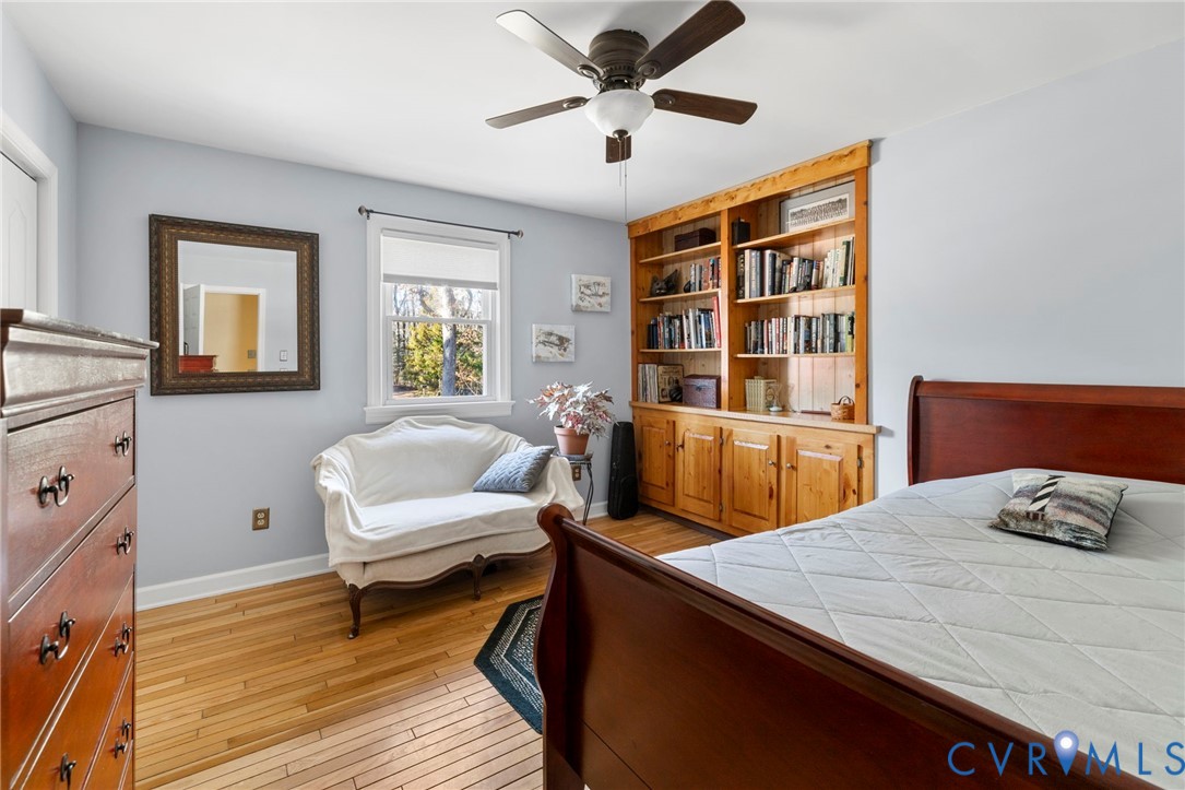 9411 Poly Place Midlothian, VA 23112 - Photo 14 of 39 a bedroom with a bed and wooden floor