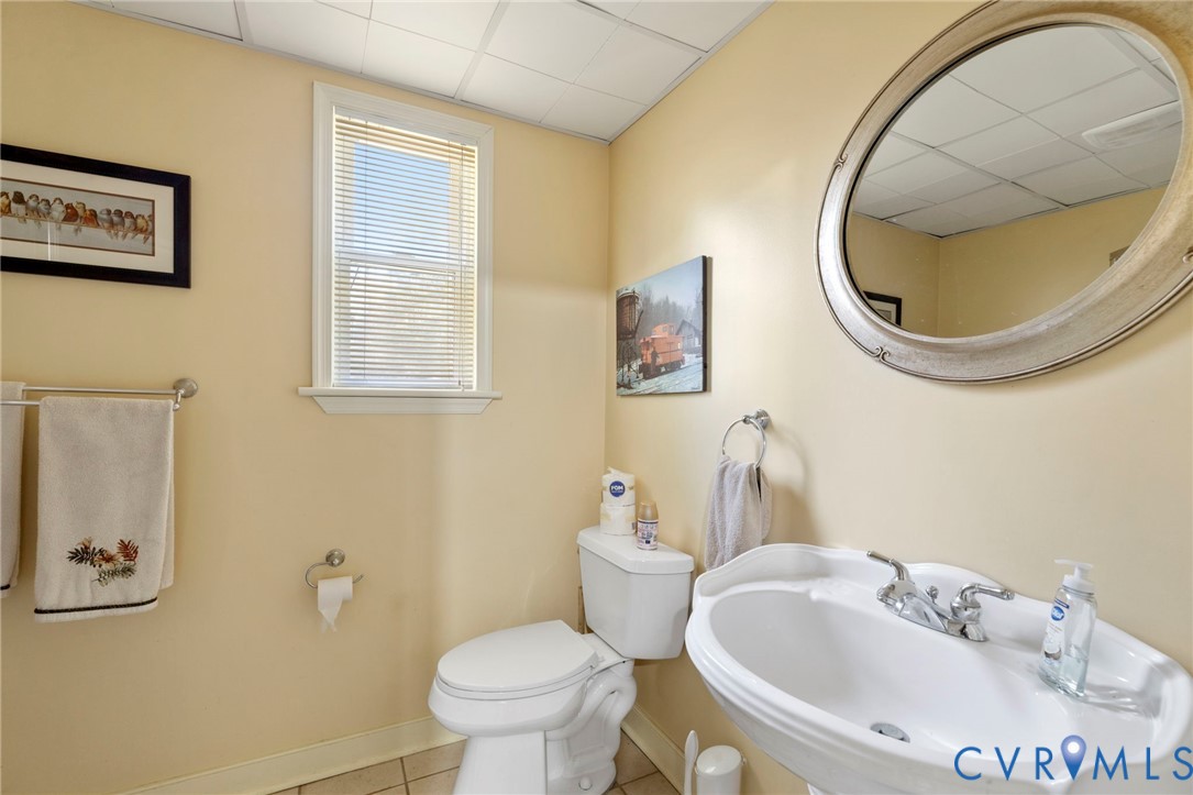 9411 Poly Place Midlothian, VA 23112 - Photo 29 of 39 a bathroom with a sink and a mirror