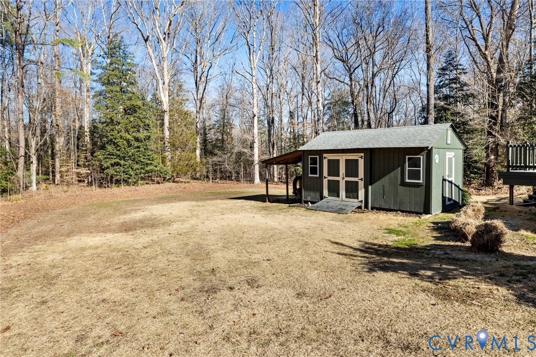 9411 Poly Place Midlothian, VA 23112 - Photo 39 of 39 a view of a house with a yard covered in snow
