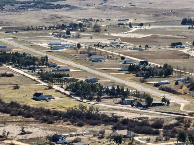 an aerial view of a house with a lake view