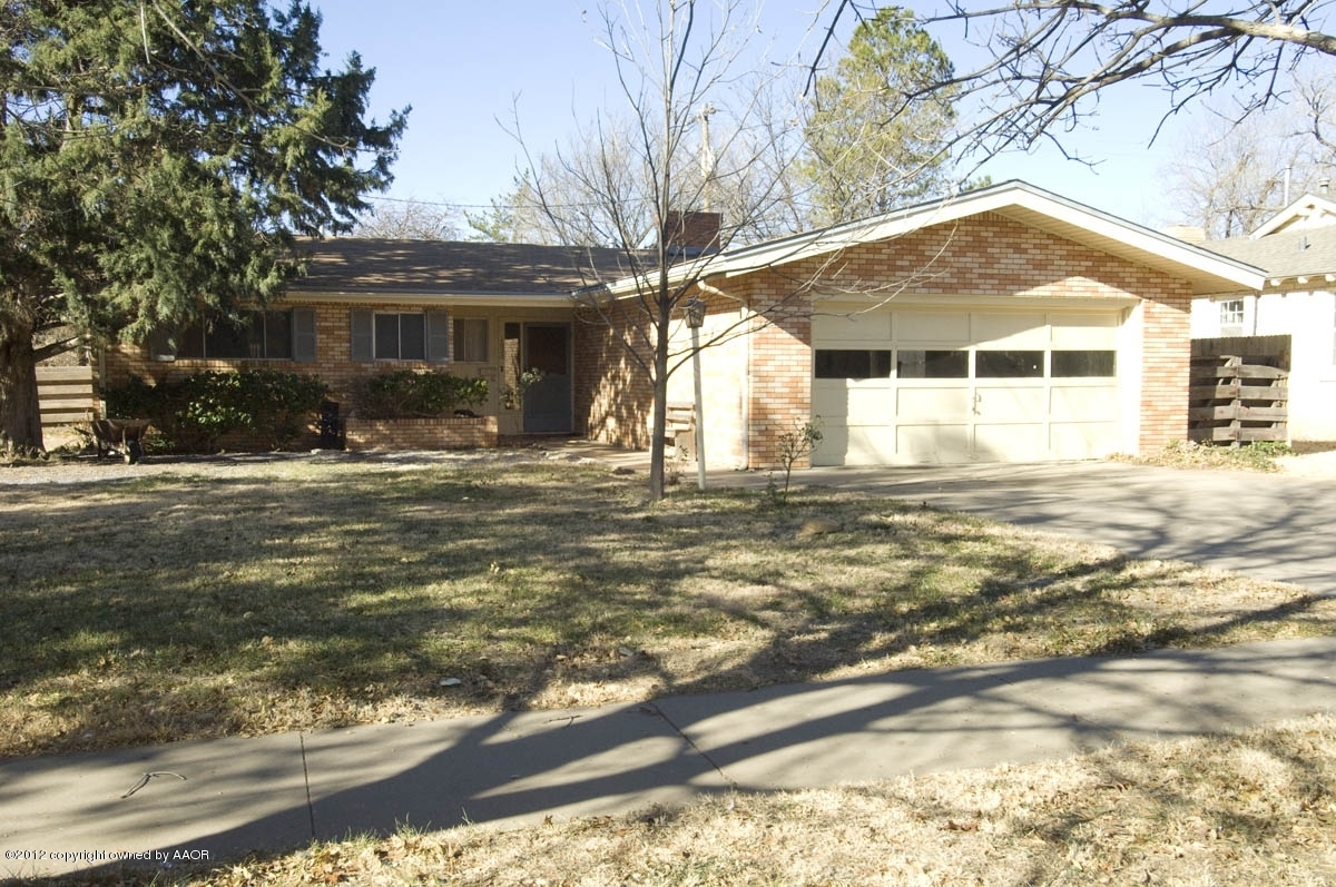 1020 South Rusk Street Amarillo, TX 79102 - Photo 1 of 32 a front view of a house with a yard