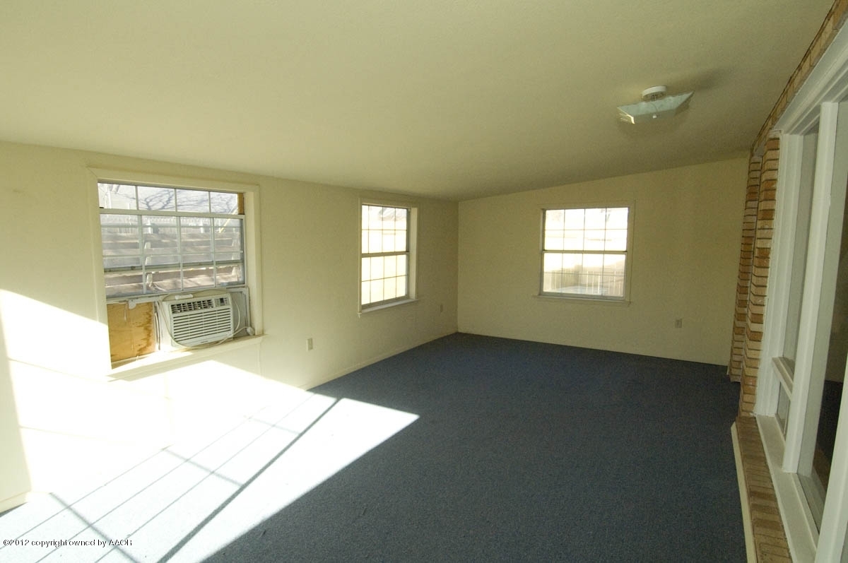 1020 South Rusk Street Amarillo, TX 79102 - Photo 26 of 32 a view of an empty room with a window