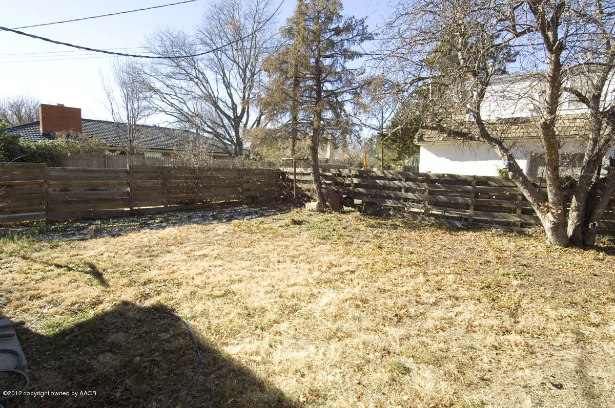 1020 South Rusk Street Amarillo, TX 79102 - Photo 29 of 32 a view of a yard covered with snow in the yard