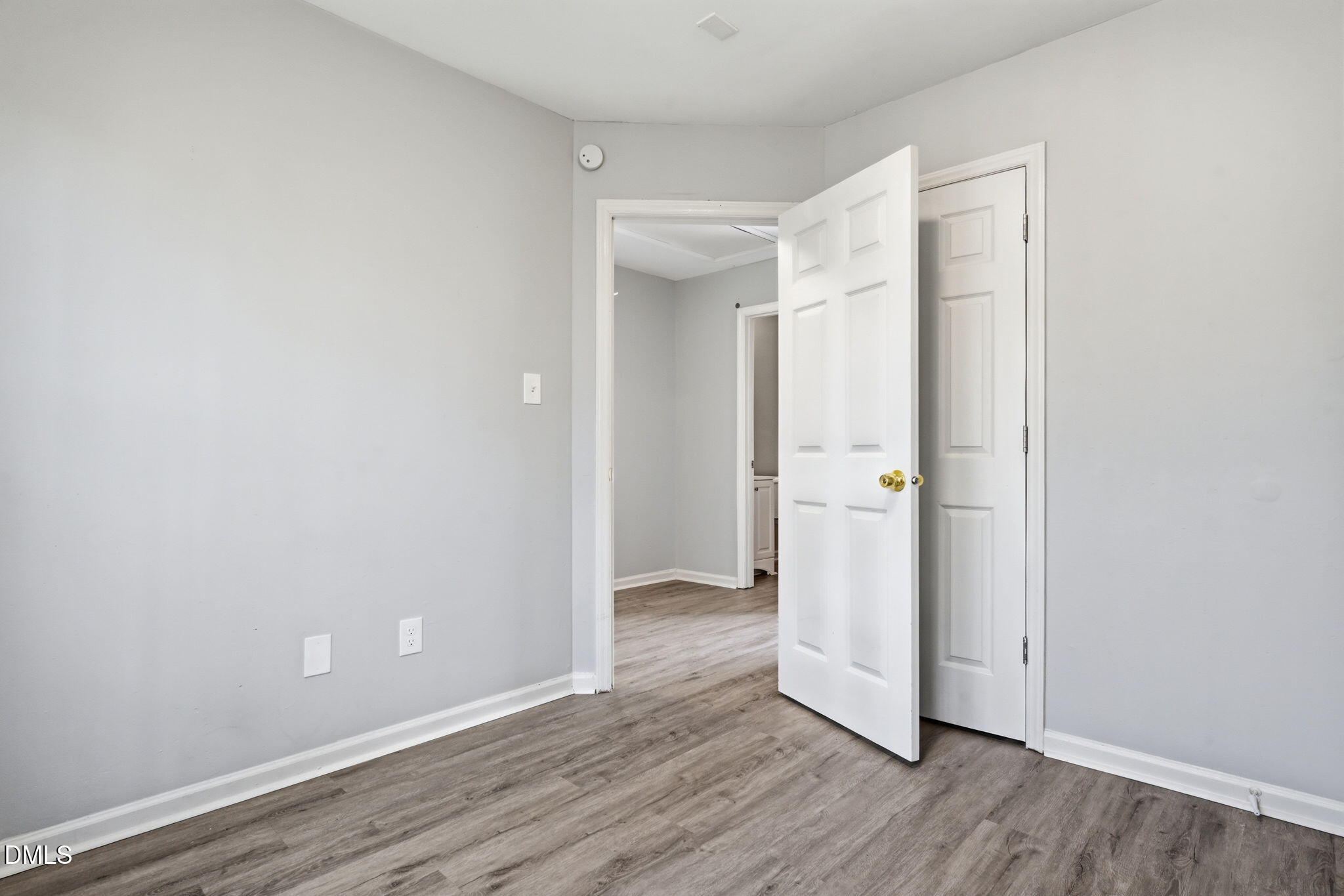 2826 Herndon Village Way Raleigh, NC 27610 - Photo 14 of 32 wooden floor in an empty room