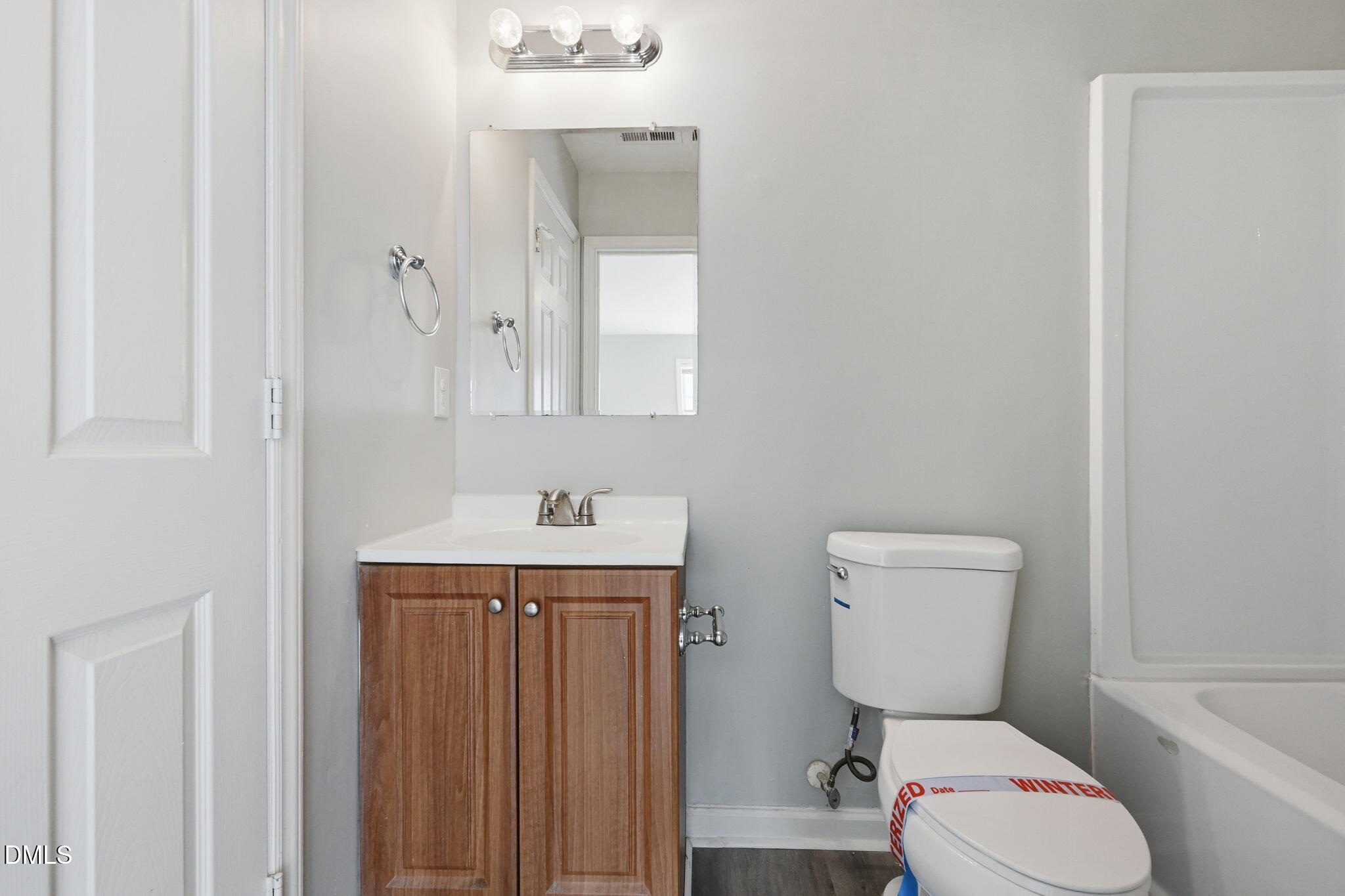 2826 Herndon Village Way Raleigh, NC 27610 - Photo 20 of 32 a white toilet sitting next to a bathroom sink