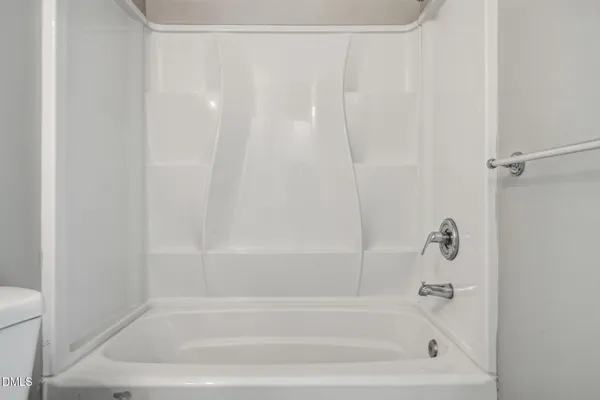 a close up of a bathtub curtain