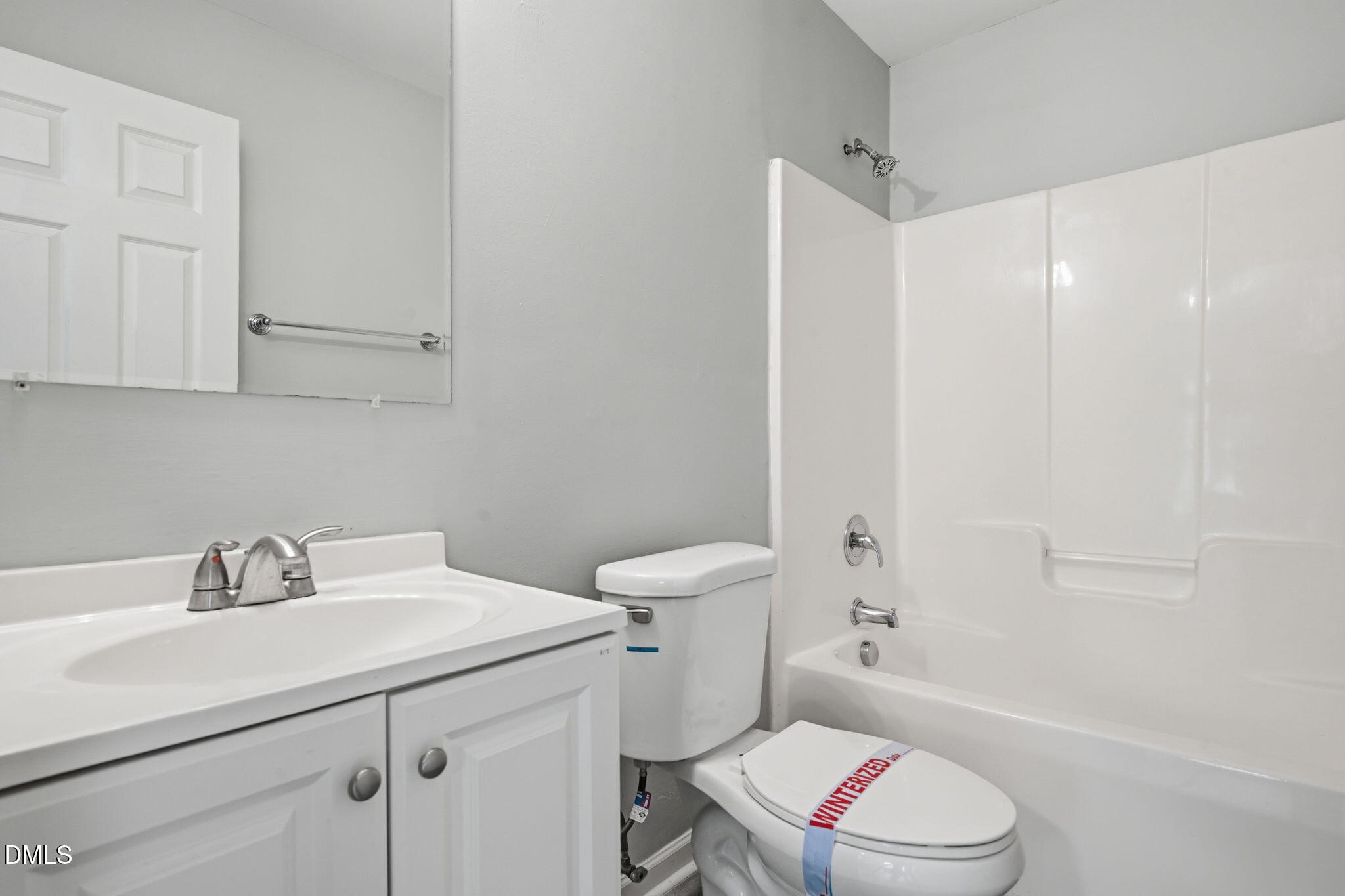 2826 Herndon Village Way Raleigh, NC 27610 - Photo 23 of 32 a bathroom with a sink toilet vanity and shower