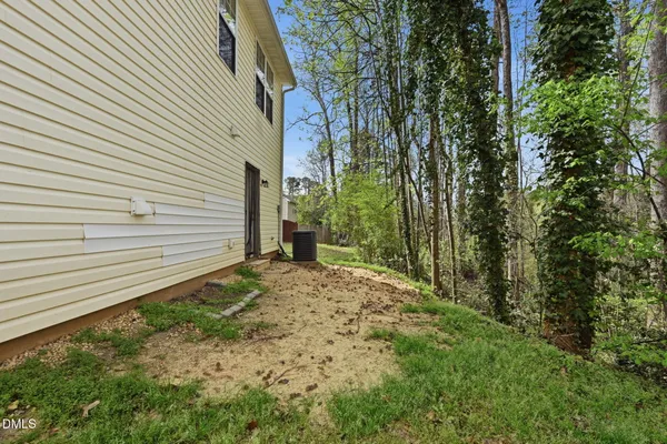 a view of a backyard of the house