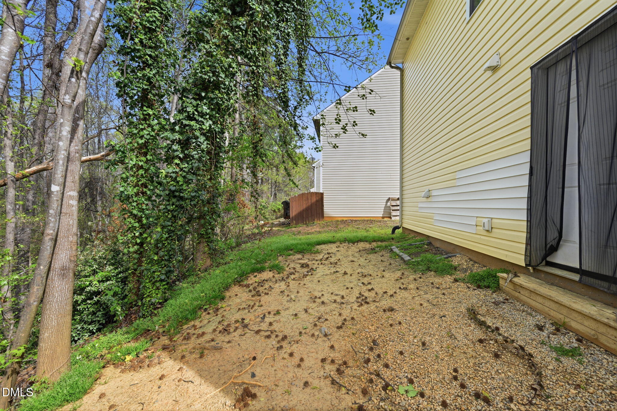 2826 Herndon Village Way Raleigh, NC 27610 - Photo 25 of 32 a house with a yard and garage