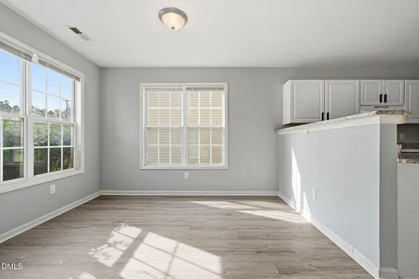 a view of a kitchen with a sink dishwasher and a refrigerator