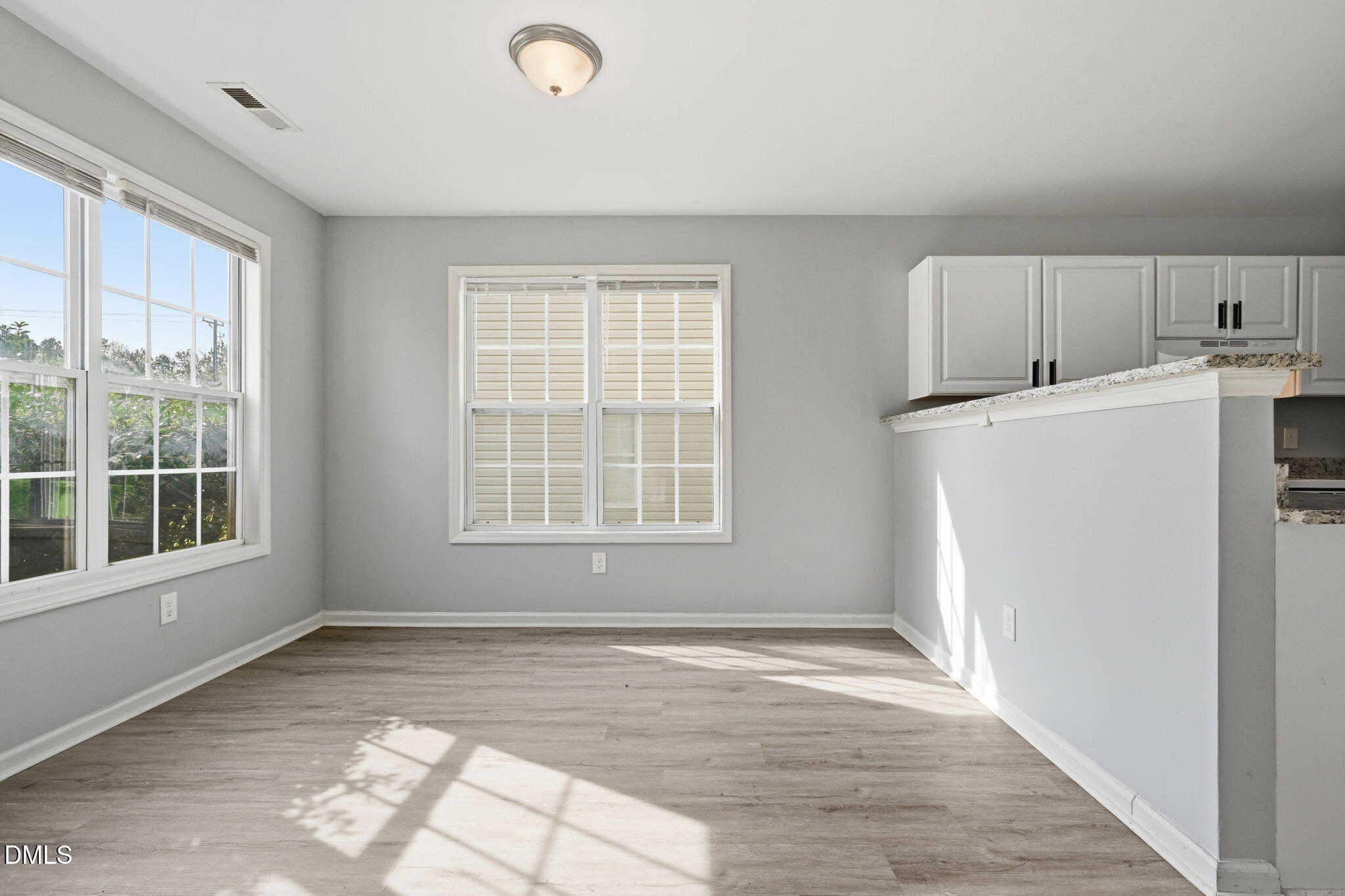 2826 Herndon Village Way Raleigh, NC 27610 - Photo 6 of 32 a view of a kitchen with a sink dishwasher and a refrigerator