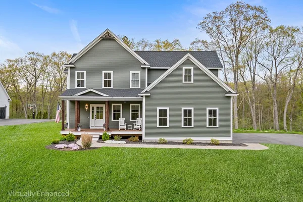 a front view of a house with a yard