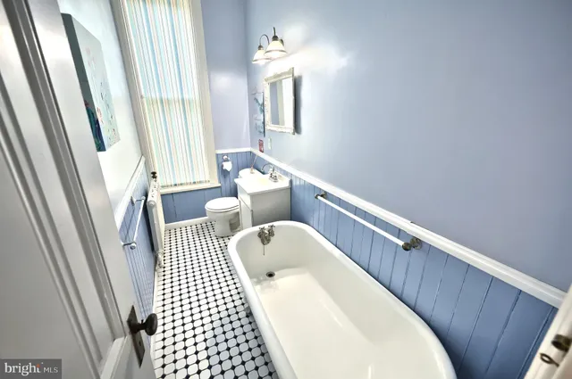 a bathroom with a sink a mirror and a shower