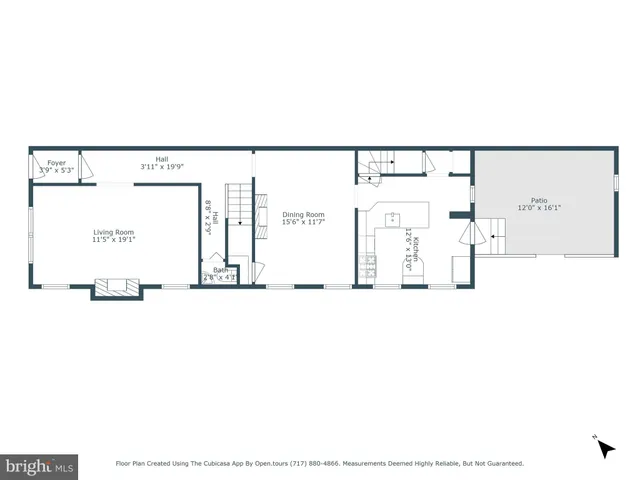 an aerial view of a house with outdoor seating