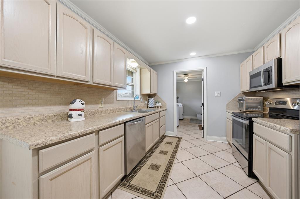 12637 Highway 19 Athens, TX 75752 - Photo 11 of 28 a kitchen with stainless steel appliances granite countertop a sink stove and cabinets