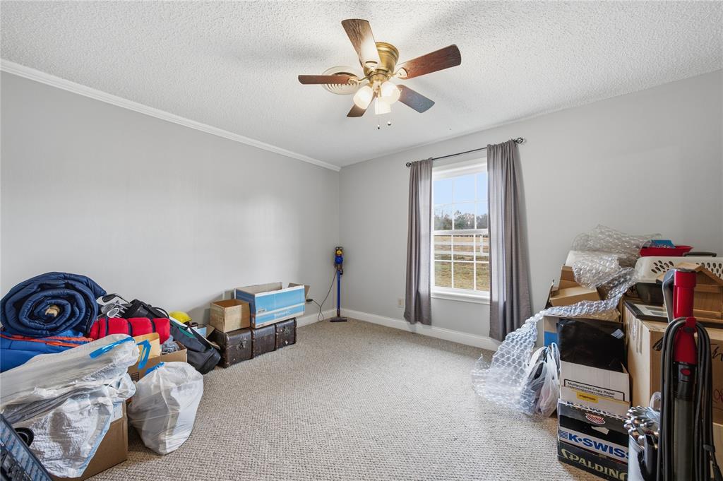 12637 Highway 19 Athens, TX 75752 - Photo 16 of 28 a bedroom with furniture and a window