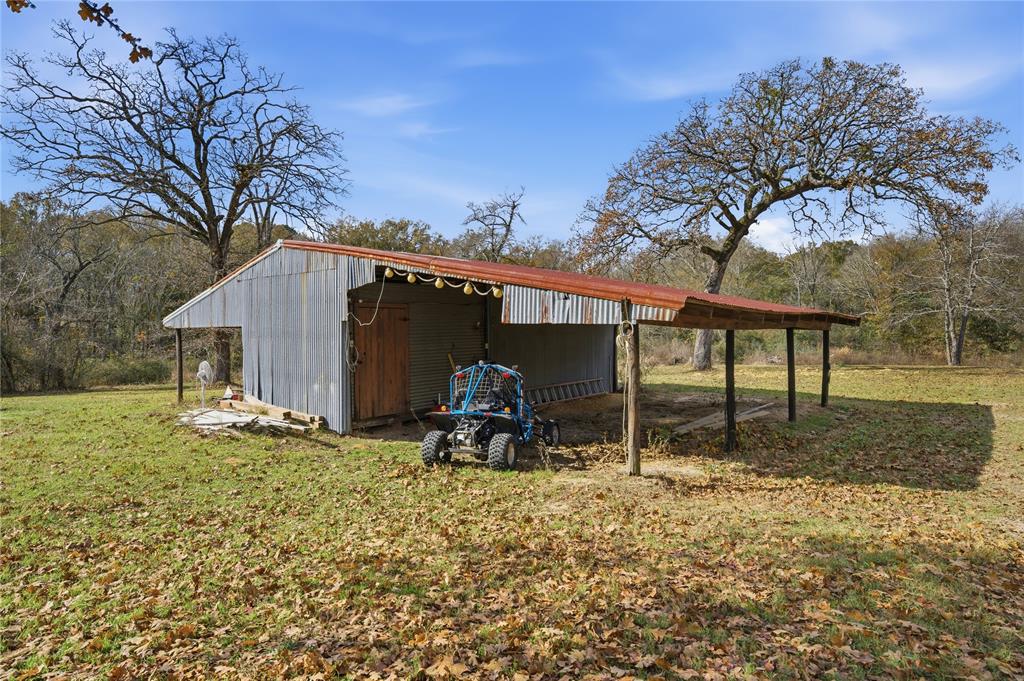 12637 Highway 19 Athens, TX 75752 - Photo 21 of 28 a backyard of a house with table and chairs