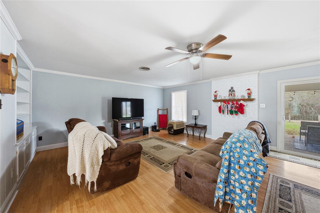 12637 Highway 19 Athens, TX 75752 - Photo 5 of 28 a living room with furniture and a flat screen tv