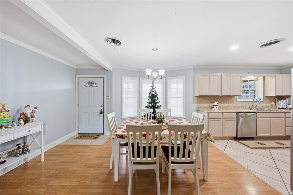 12637 Highway 19 Athens, TX 75752 - Photo 7 of 28 a kitchen with kitchen island granite countertop a dining table chairs cabinets and stainless steel appliances