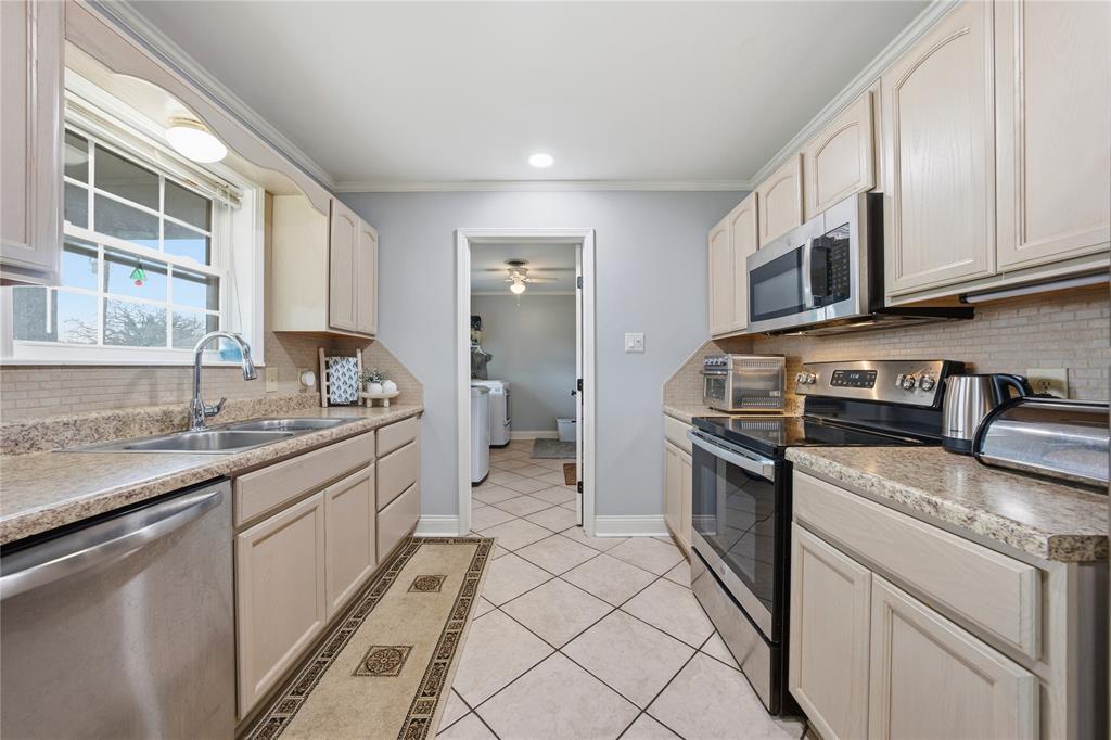 12637 Highway 19 Athens, TX 75752 - Photo 10 of 28 a kitchen with stainless steel appliances granite countertop a sink stove and cabinets