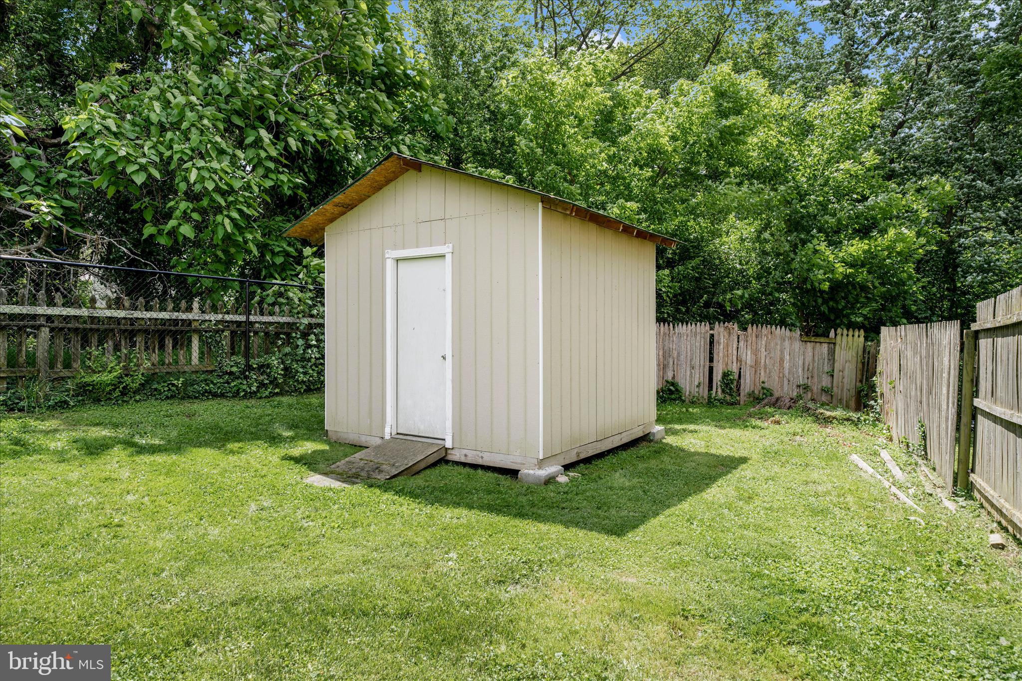 713 Seek Lane Silver Spring, MD 20912 - Photo 52 of 60 a view of backyard with tub and trees