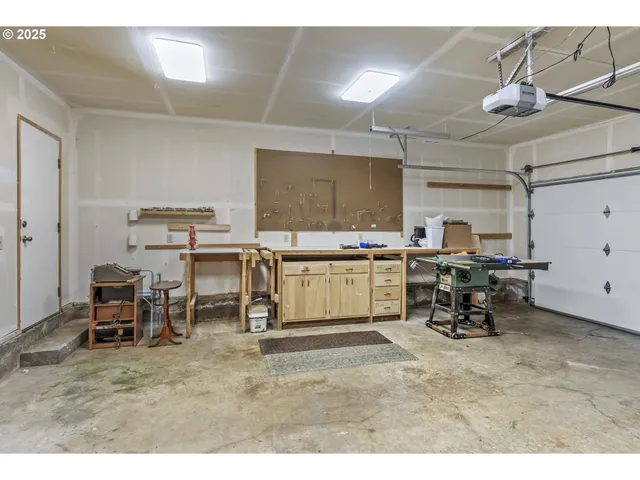 a living room with lots of furniture and clutter