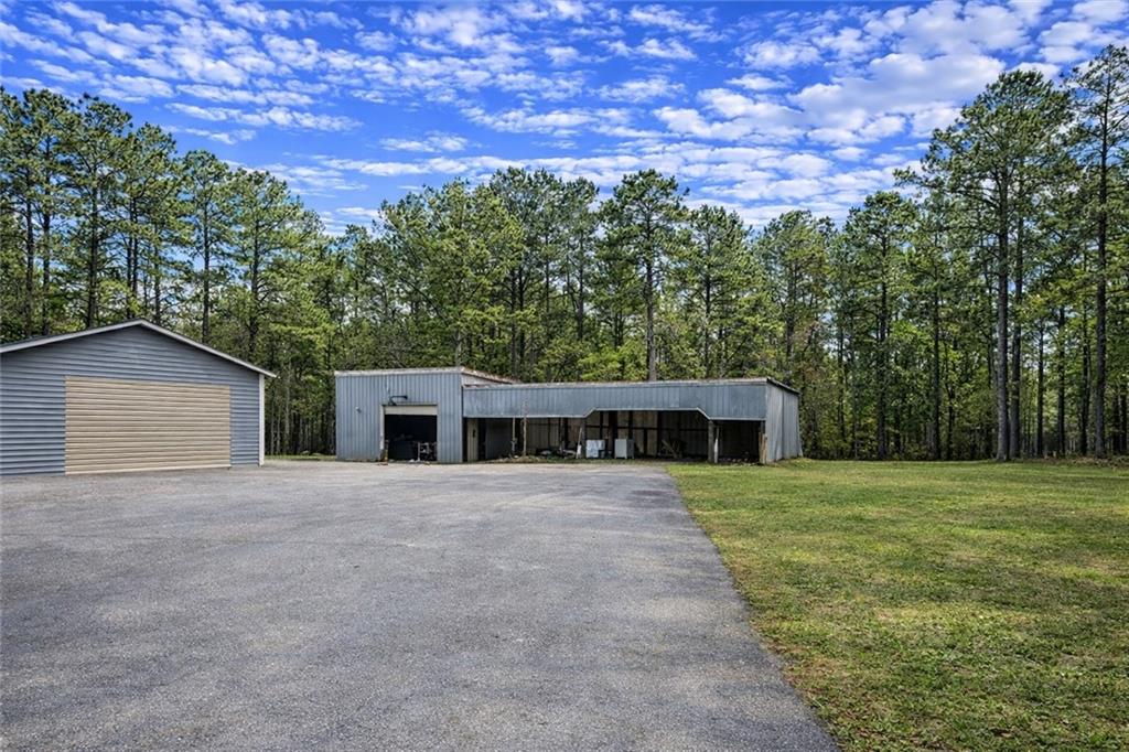 924 Highway 138 Stockbridge, GA 30281 - Photo 9 of 10 a front view of a house with a yard and trees
