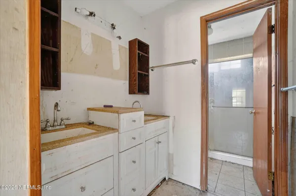 a bathroom with a sink and a mirror