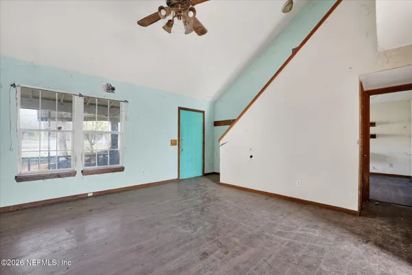 a view of an empty room with a window