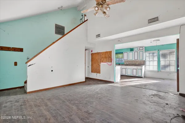 a view of an empty room with a window