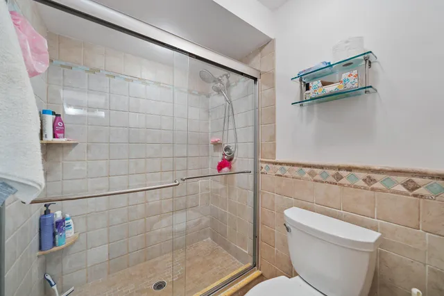 a bedroom with a bed and a chair