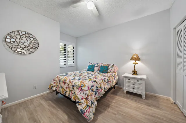 a bedroom with a bed and a window in it