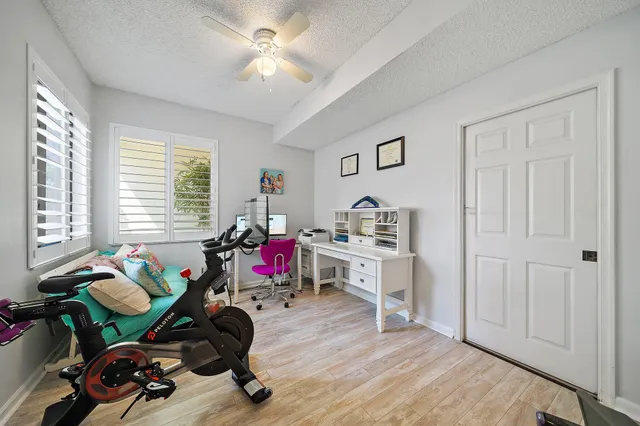 a utility room with fridge dryer and washer