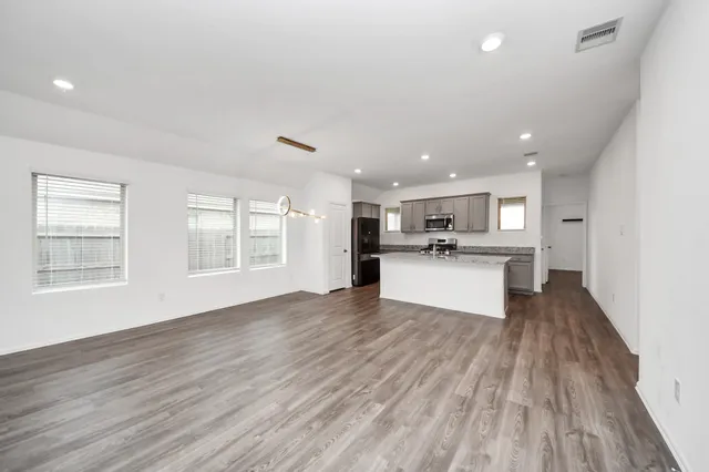 a view of kitchen with wooden floor