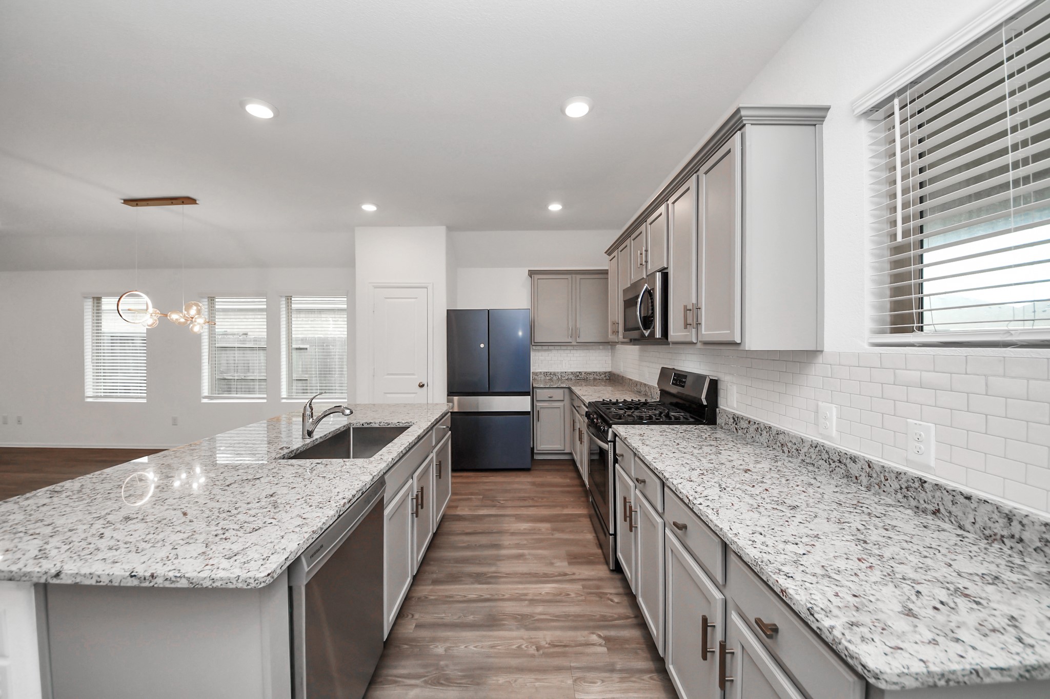 14230 Elrington Holw Trail Rosharon, TX 77583 - Photo 17 of 42 a kitchen with granite countertop counter top space a sink stainless steel appliances and cabinets