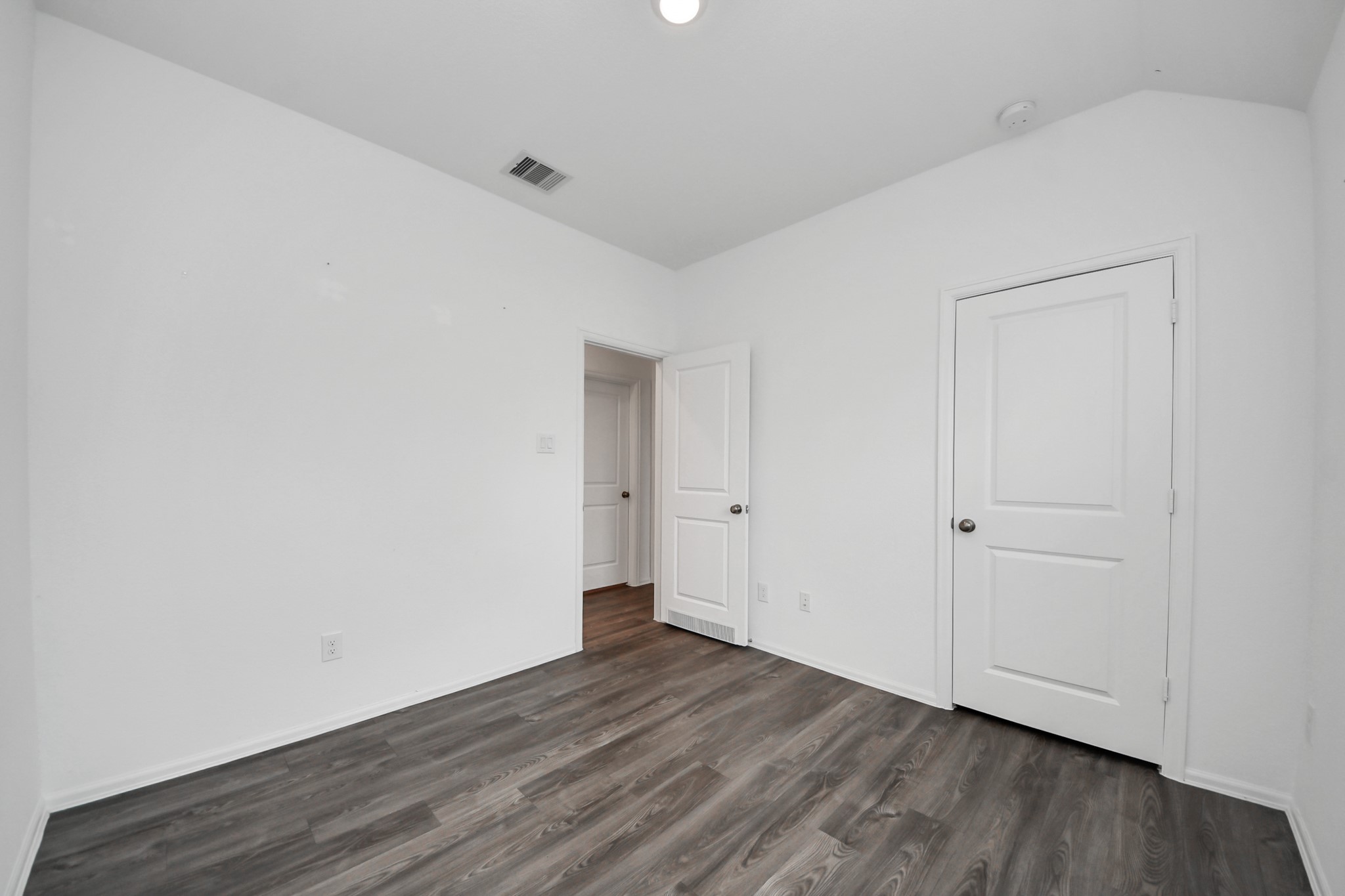 14230 Elrington Holw Trail Rosharon, TX 77583 - Photo 22 of 42 a view of an empty room with wooden floor