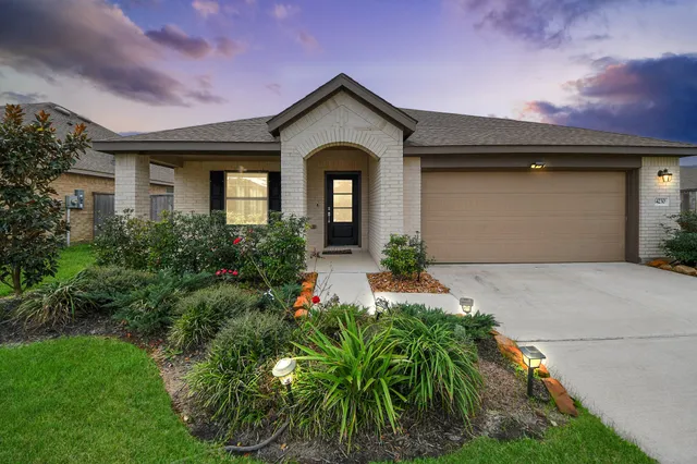 a front view of a house with garden