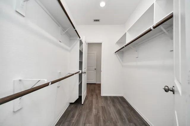 a bathroom with a double vanity sink and mirror