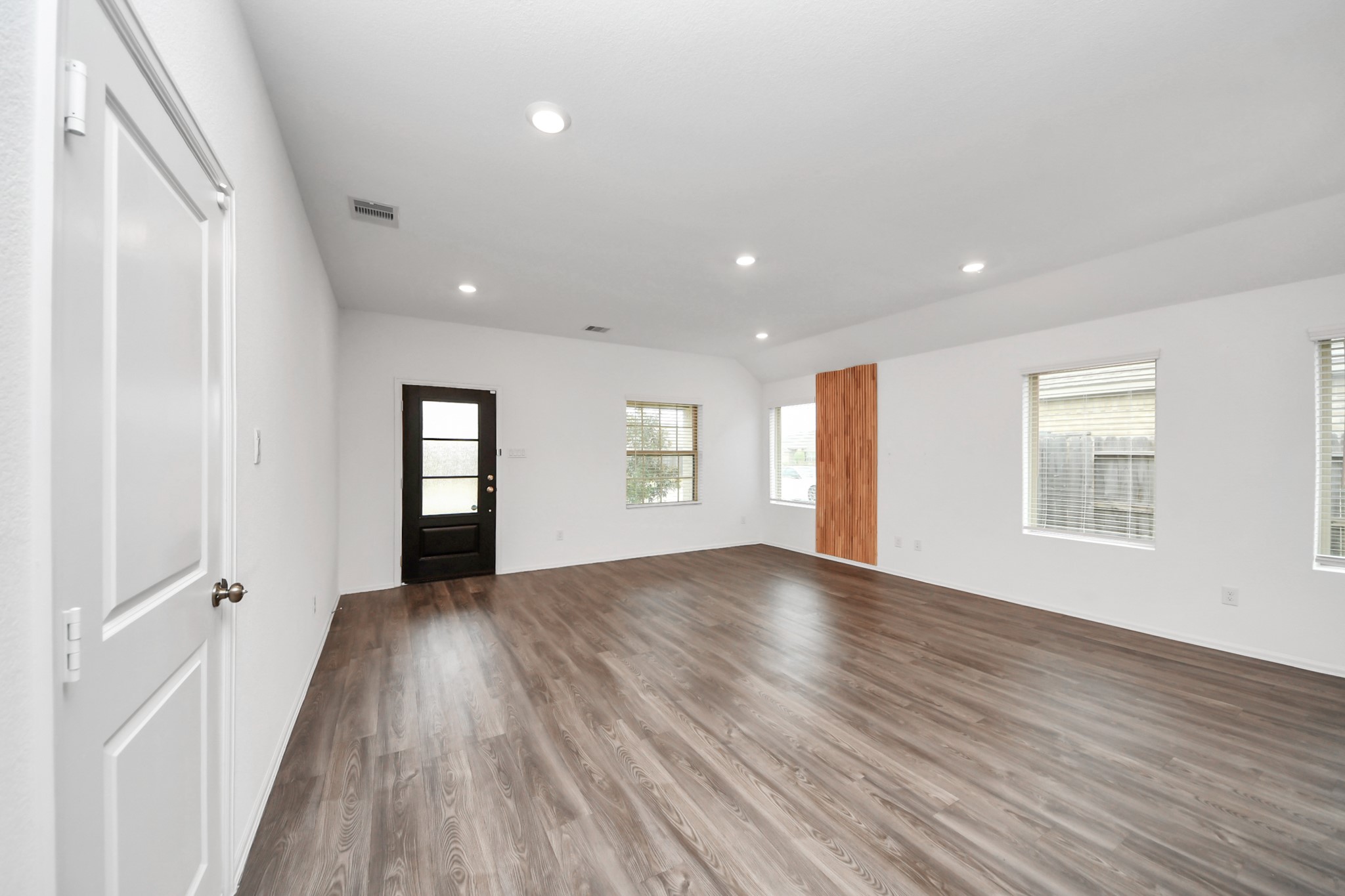 14230 Elrington Holw Trail Rosharon, TX 77583 - Photo 9 of 42 wooden floor in an empty room with a window