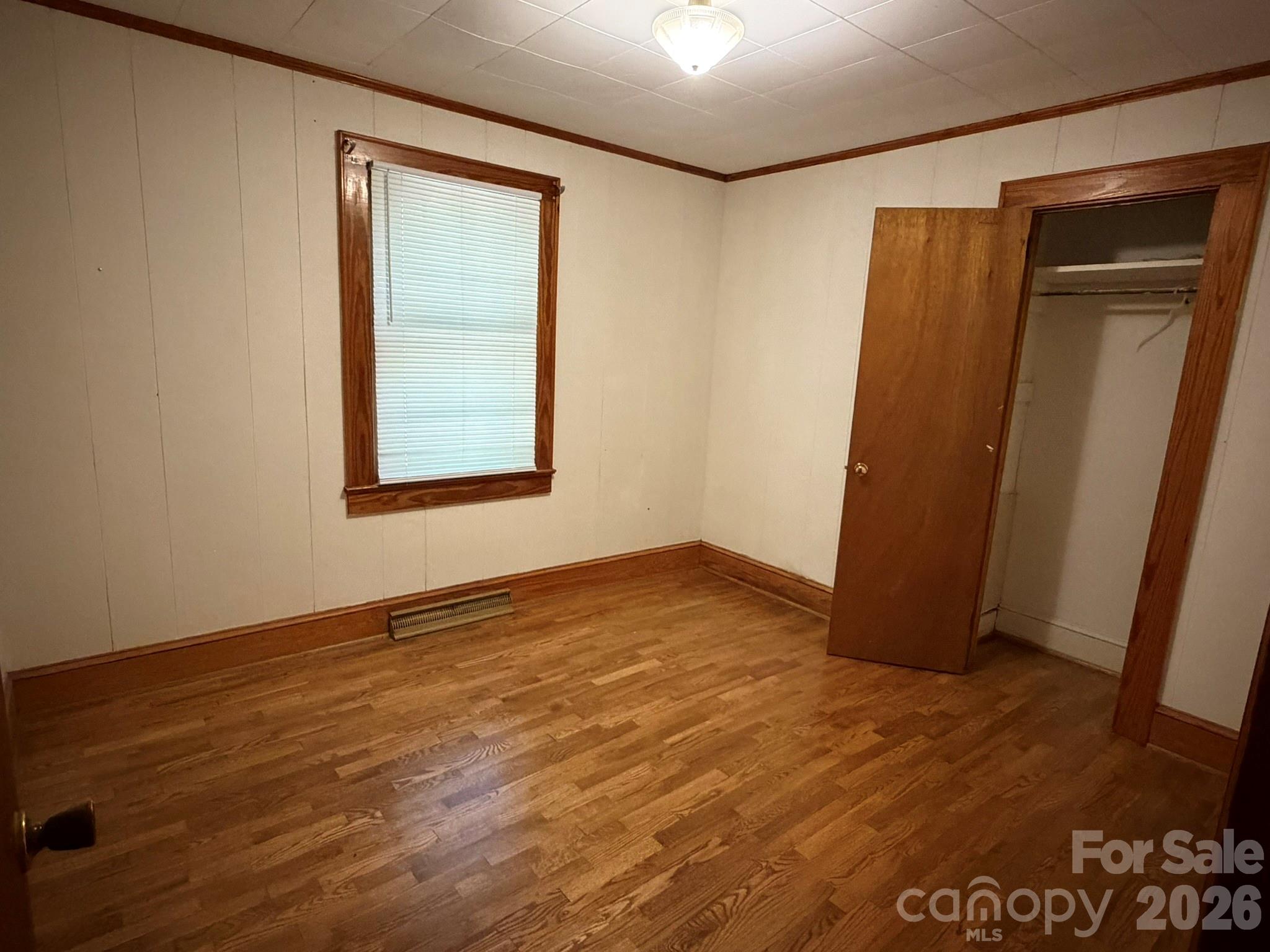 382 Alexis High Shoals Road Dallas, NC 28034 - Photo 26 of 43 an empty room with wooden floor and closet