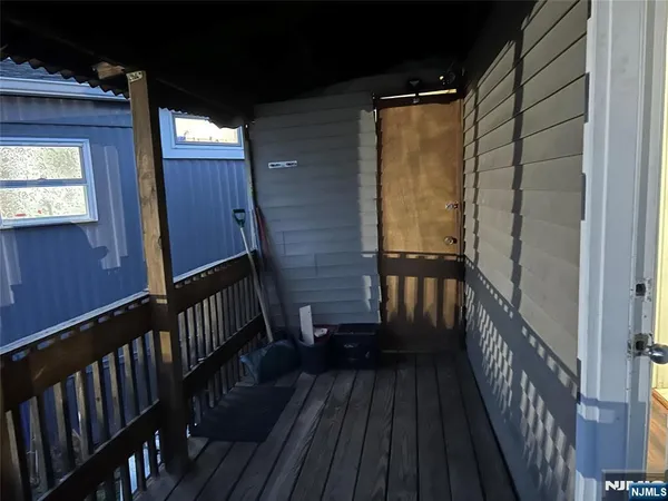 a view of balcony with wooden floor