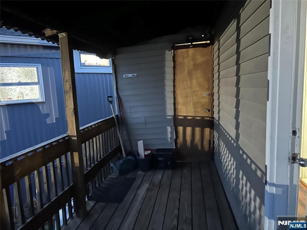 40 Poplar Street Lodi, NJ 07644 - Photo 12 of 13 a view of balcony with wooden floor