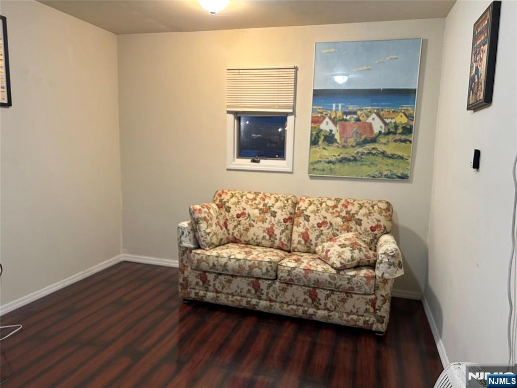 40 Poplar Street Lodi, NJ 07644 - Photo 4 of 13 a living room with furniture and a fireplace