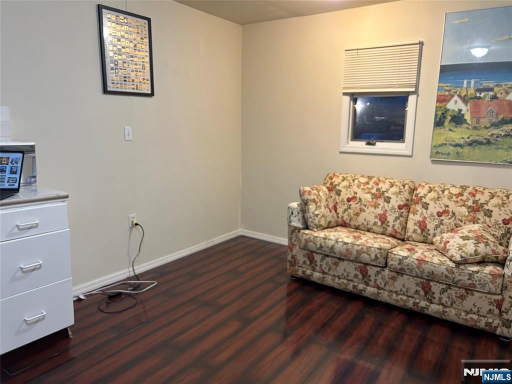 40 Poplar Street Lodi, NJ 07644 - Photo 5 of 13 a living room with furniture and a wooden floor