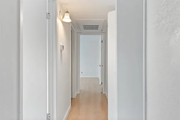 a view of a bathroom from a hallway