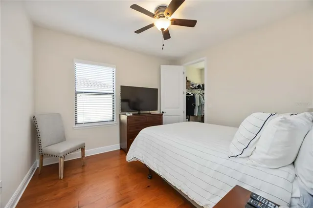 a bedroom with a bed and a chair