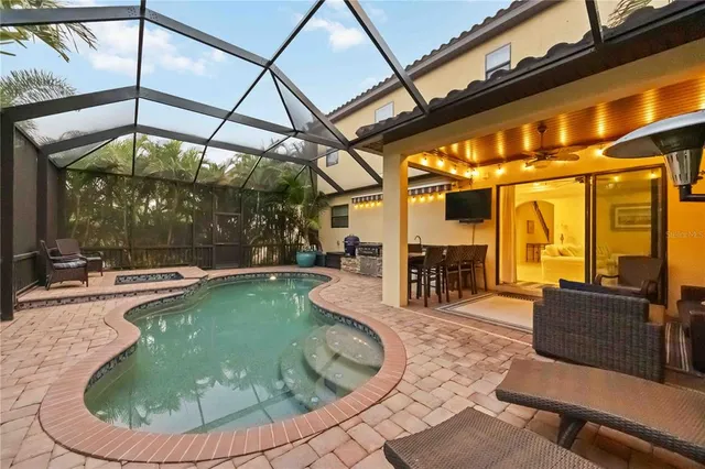 a view of a swimming pool with a patio