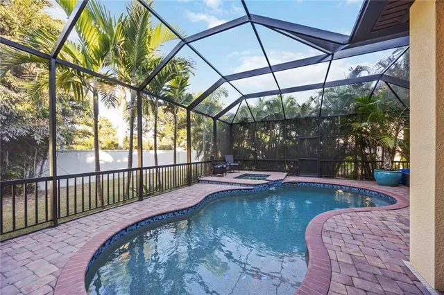 a view of a swimming pool with a patio