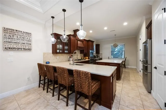 a large kitchen with a table and chairs